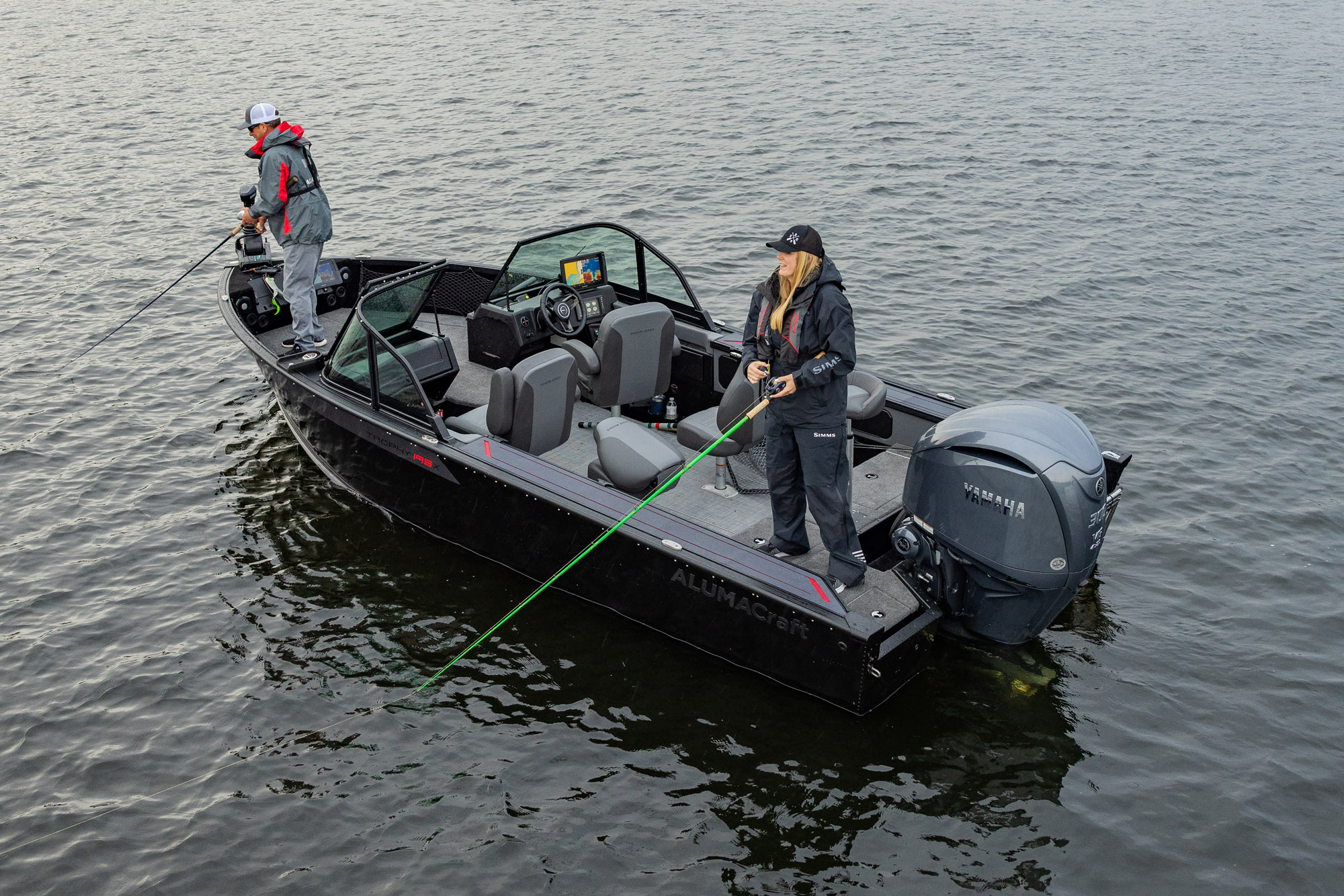 Man with his son fishing from an Alumacraft aluminum fishing boat
